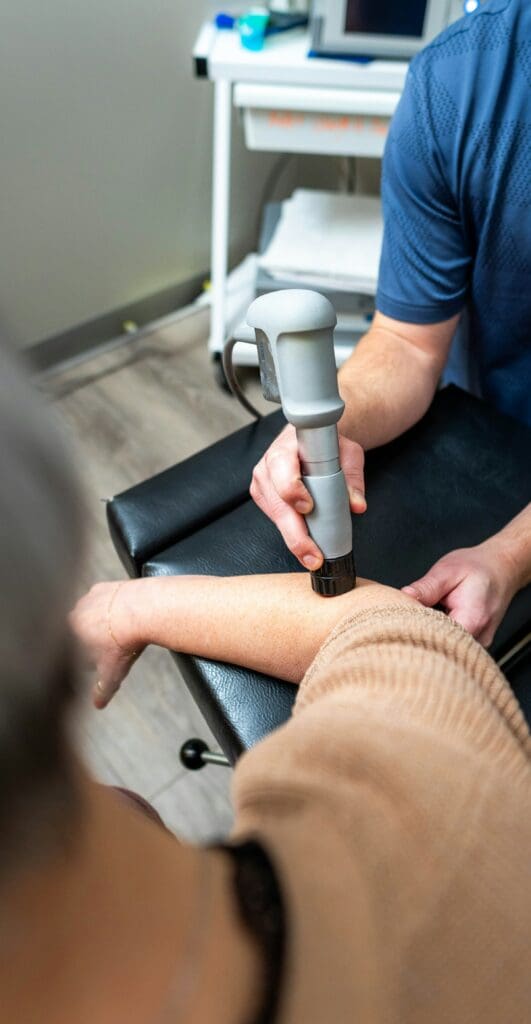 Shockwave therapy houston treatment applied to forearm for pain relief